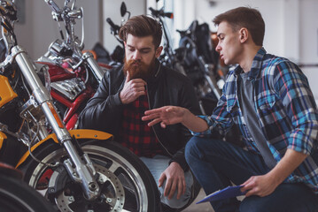 Men in motorbike salon