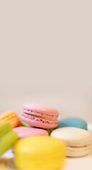colorful macaroons on wooden background