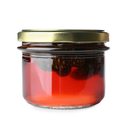 Jar of tasty pine cone jam on white background