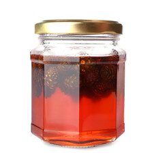 Jar of tasty pine cone jam on white background