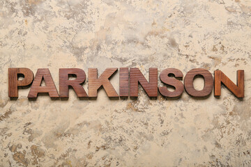 Wooden word PARKINSON on grunge background