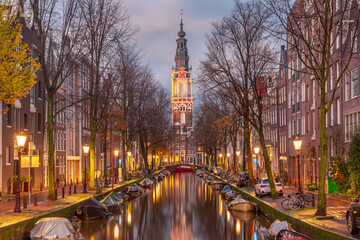 Fototapeta premium Evening Amsterdam canal Groenburgwal with Zuiderkerk, southern church, Holland, Netherlands.