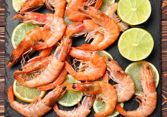 Board of tasty shrimps on table