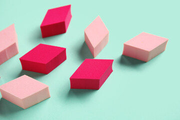 Obraz premium Different makeup sponges on turquoise background, closeup