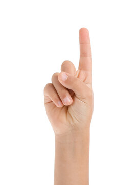 Child's hand with raised index finger on white background