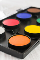 Orange watercolor chalk closeup. Vertical