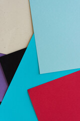 blue, red, black, purple paper background (top down view) with blank space