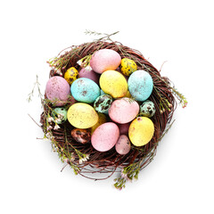 Nest with colorful Easter eggs isolated on white background