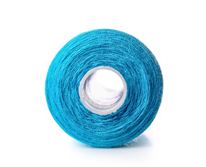 Blue sewing thread spool on white background