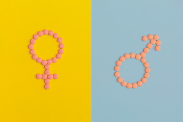 Female and male sign on color background. Top view. Flat lay.