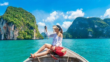 Traveler woman on boat with camera joy nature scenic landscape Lao Lading island Krabi, Attraction famous place tourist travel Phuket Thailand summer holiday vacation trip, Beautiful destination Asia