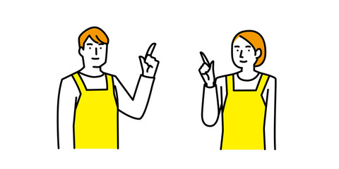 上を指差し案内をするエプロン姿の男性と女性