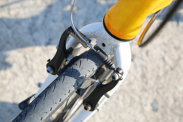 Take a close-up shot of the bicycle brake parts.

