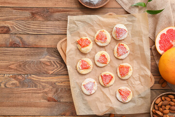 Tasty grapefruit cookies on table