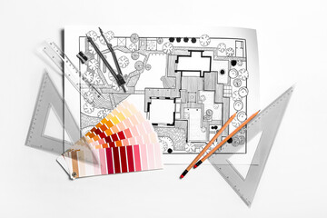 Plan of landscape designer with stationery and paint palettes on white background