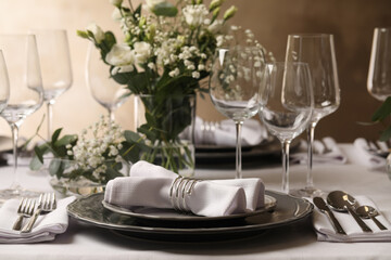 Stylish elegant table setting for festive dinner in restaurant