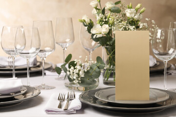 Stylish elegant table setting for festive dinner in restaurant