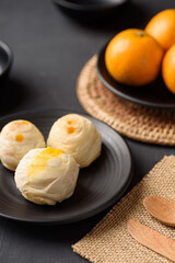Thai mooncake or Chinese pastry on black background