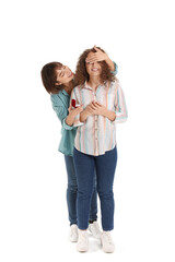 Young lesbian woman proposing to her girlfriend on white background