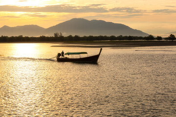 Sunrise from a longtail boat off the coast of Ranong Province, Thailand.
