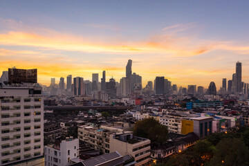 Aerial view of modern office buildings in Bangkok's downtown with sunrise time, Bangkok, Thailand