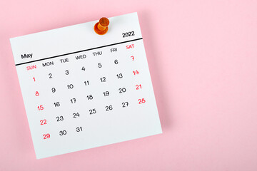 Calendar desk 2022 in May, The concept of planning and deadline with a push pin on the calendar...