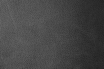 As a backdrop, a black leather texture is used.