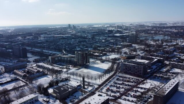 Aerial top view of Zwolle, surrounded by houses, green trees and canal