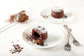 Plate with tasty lava cake fondant on light background