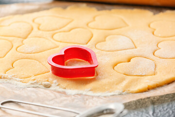 Fresh dough and molds on table. Valentines Day celebration