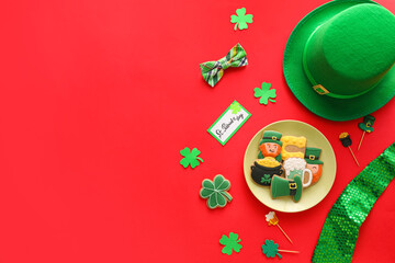 Composition with tasty gingerbread cookies for St. Patrick's Day celebration on red background