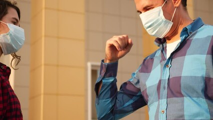 dad and daughter touch elbows social distance. bump avoid greeting. coronavirus pandemic concept. people meeting greet each other at covid 19 distance observing social distance. bump avoid greeting