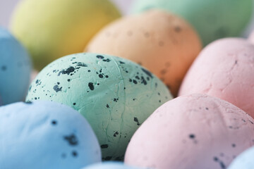 easter concept with multi color egg on pink background.