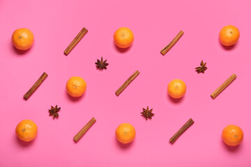 Composition with ripe tangerines, star anise and cinnamon on color background
