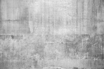 Real grey concrete wall with rough cracked grunge textures