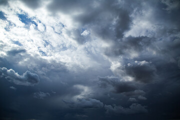 Dramatic dark rain clouds with a small parting of light
