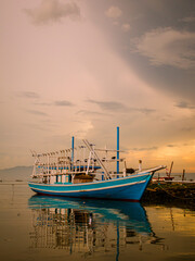 fishing boats at sunset