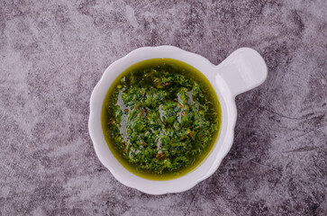 Green sauce in ceramic dishes