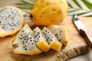 Delicious cut dragon fruit (pitahaya) on wooden board, closeup