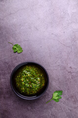 Green sauce in ceramic dishes