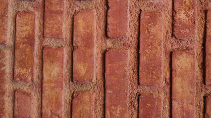 Red orange weathered brick wall