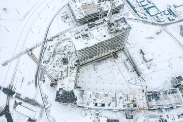 construction of modern high-rise apartment buildings in new residential area. winter. viewpoint from above.