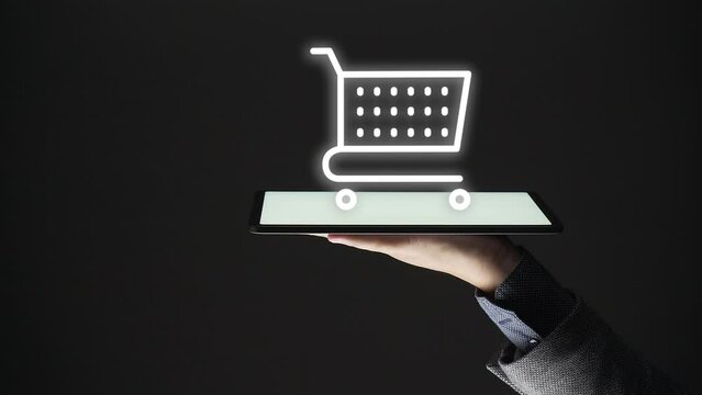 online shopping concept. business man hand show  a shopping cart on a tablet. e commerce. store