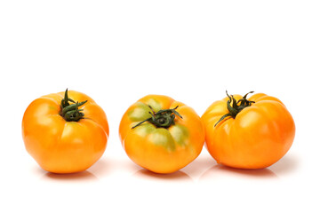 fresh yellow tomatoes on white background 