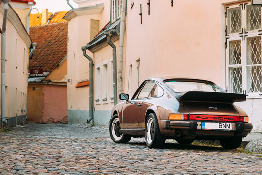 Tallinn, Estonia - July 1, 2019: Front View Of Porsche 930 Car Parked In Old Narrow Street. It is a sports car manufactured by German automobile manufacturer Porsche Between 1975 And 1989.