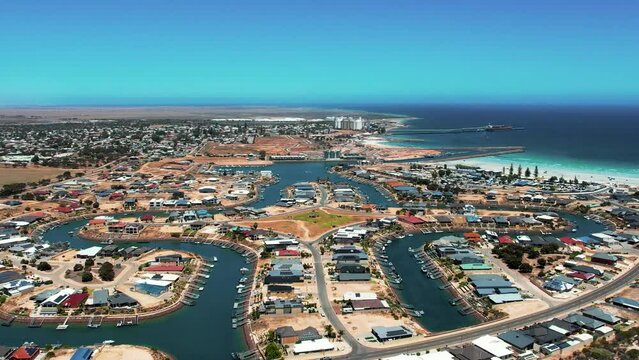 Aerial pullback revealing Beautiful marina housing complex, Wallaroo Marina, Copper Cove