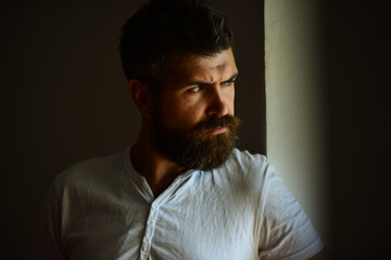 Fototapeta premium Shadow male face. Close up portrait of guy with serious profile face. Handsome man with serious face.