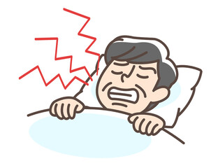 歯ぎしりをする男性