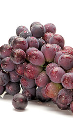 bunch of purple grapes on white background.