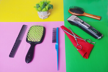 Hairdressing tools on a colored background. 